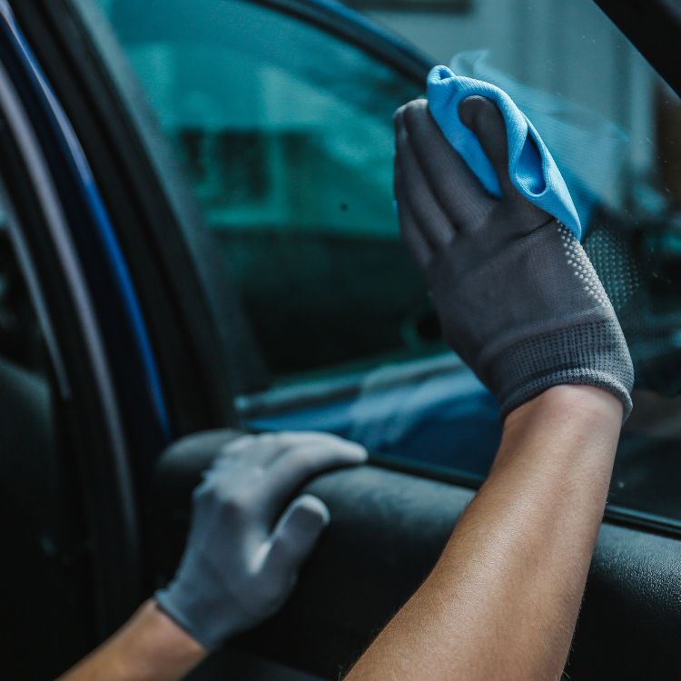 Technician installing window tint