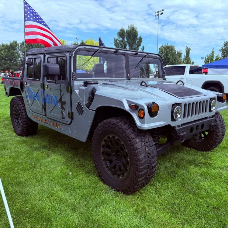 Gray Humvee with Blue Zero branding